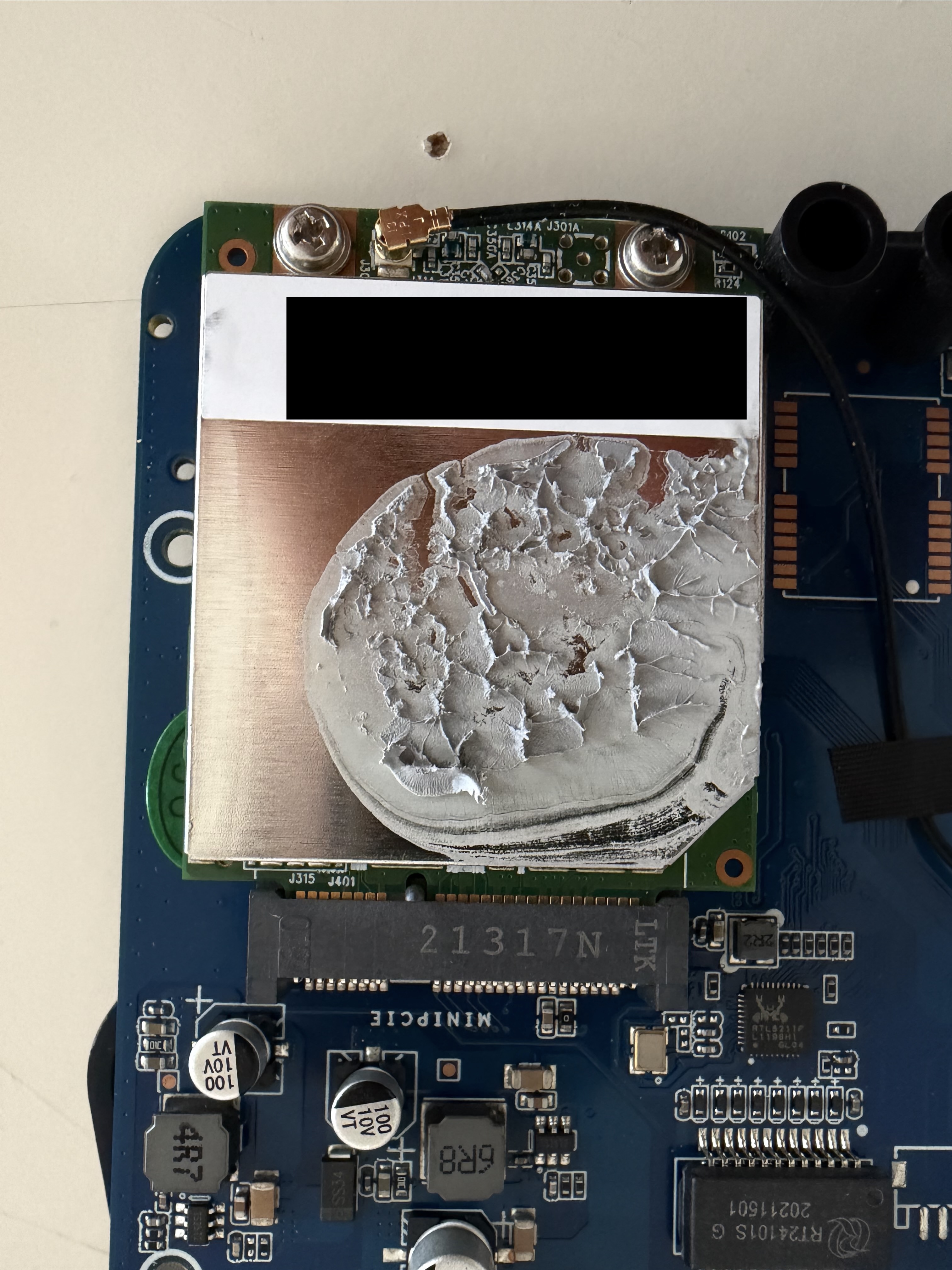 Close-up of mini PCIe LoRa concentrator card with dried thermal paste